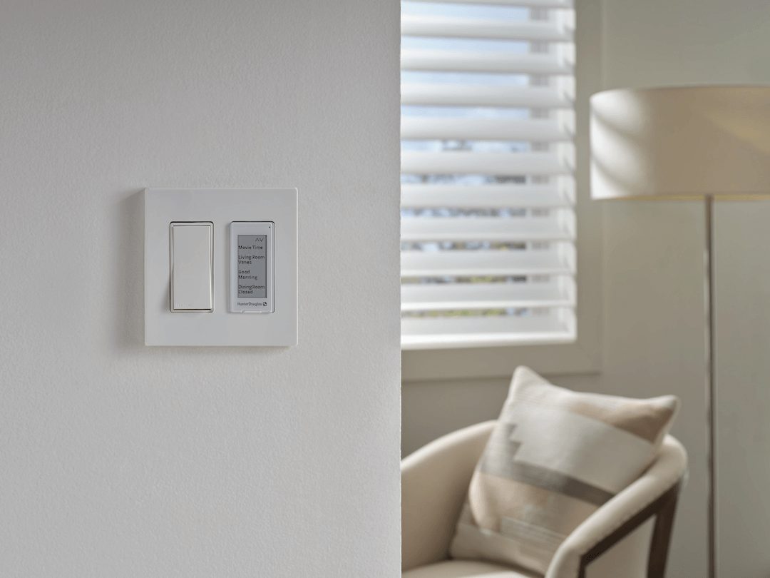 Automated Silhouette® Sheer Shades with a surface mount wall switch