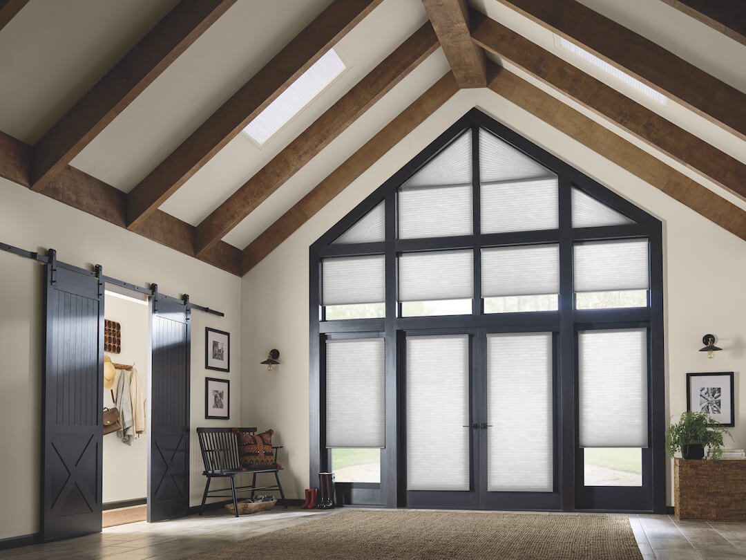 Motorized Applause® Cellular Shades on skylights, angled windows, and French doors